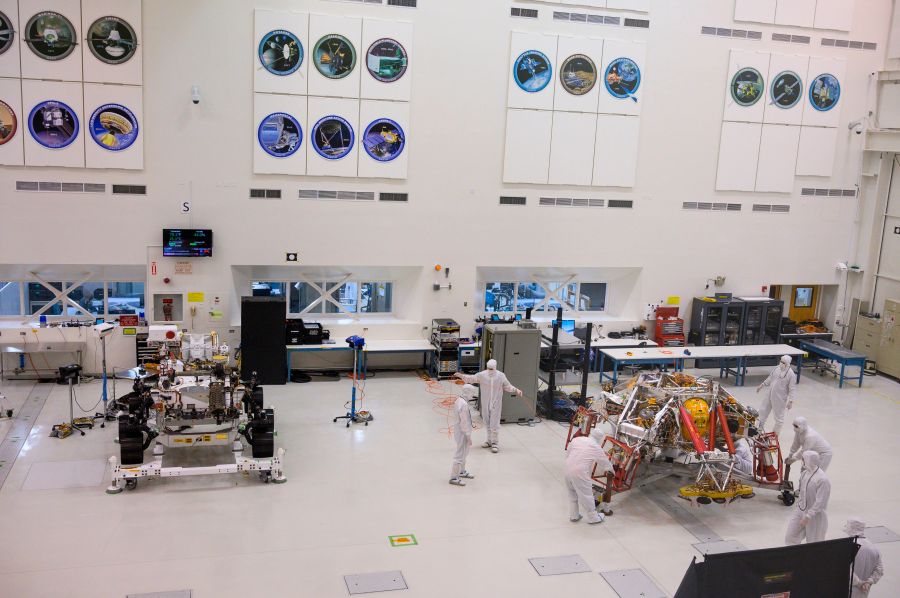 NASA engineers and technicians move the Mars 2020 spacecraft descent stage on Dec. 27, 2019, during a media tour of the spacecraft assembly area clean room at NASA's Jet Propulsion Laboratory in Pasadena. (ROBYN BECK/AFP via Getty Images)