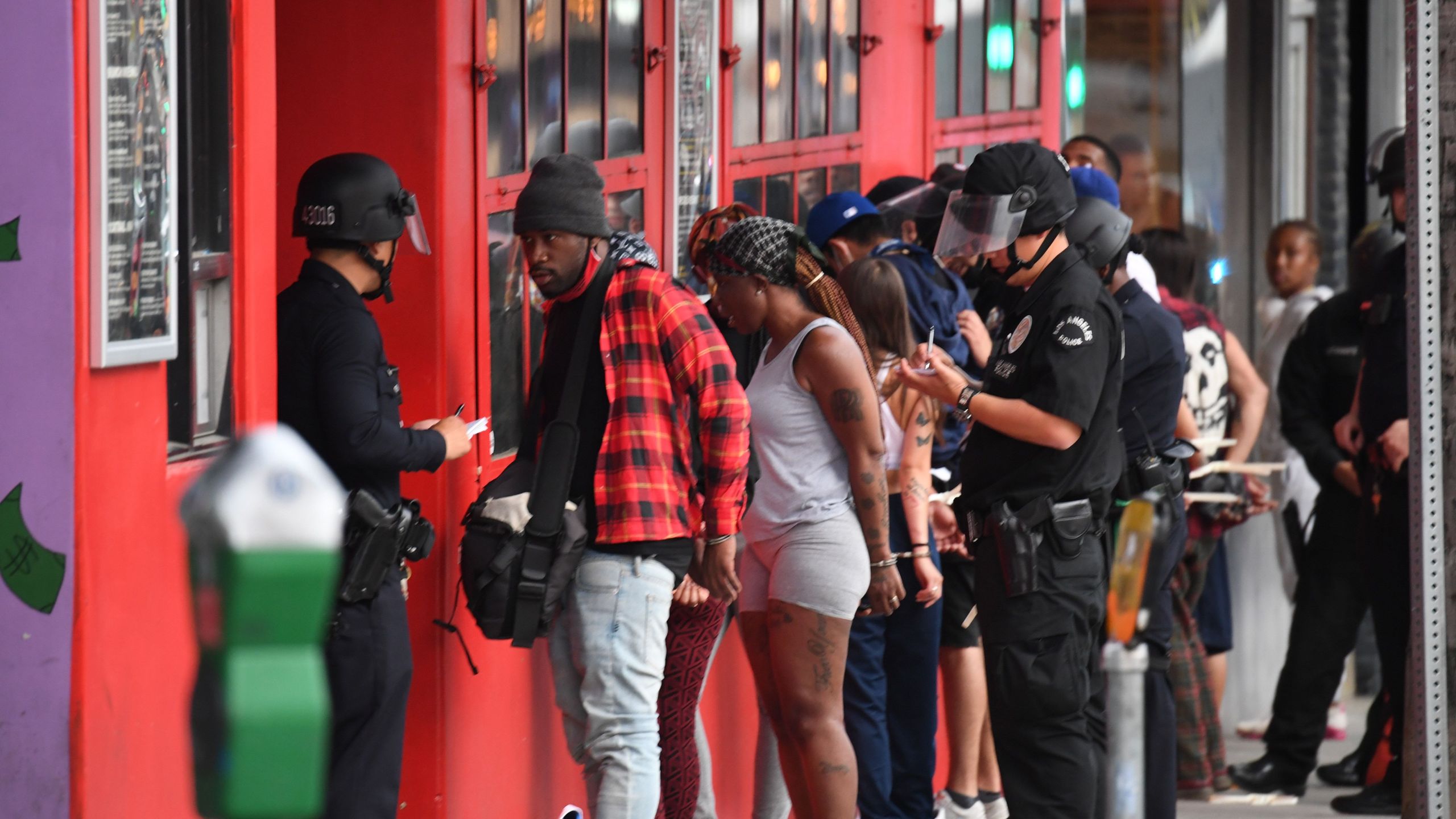 People are arrested in Hollywood on June 1, 2020, as a third night of curfews followed days of massive, mostly peaceful protests to decry George Floyd's death in Minneapolis. (Robyn Beck / AFP via Getty Images)