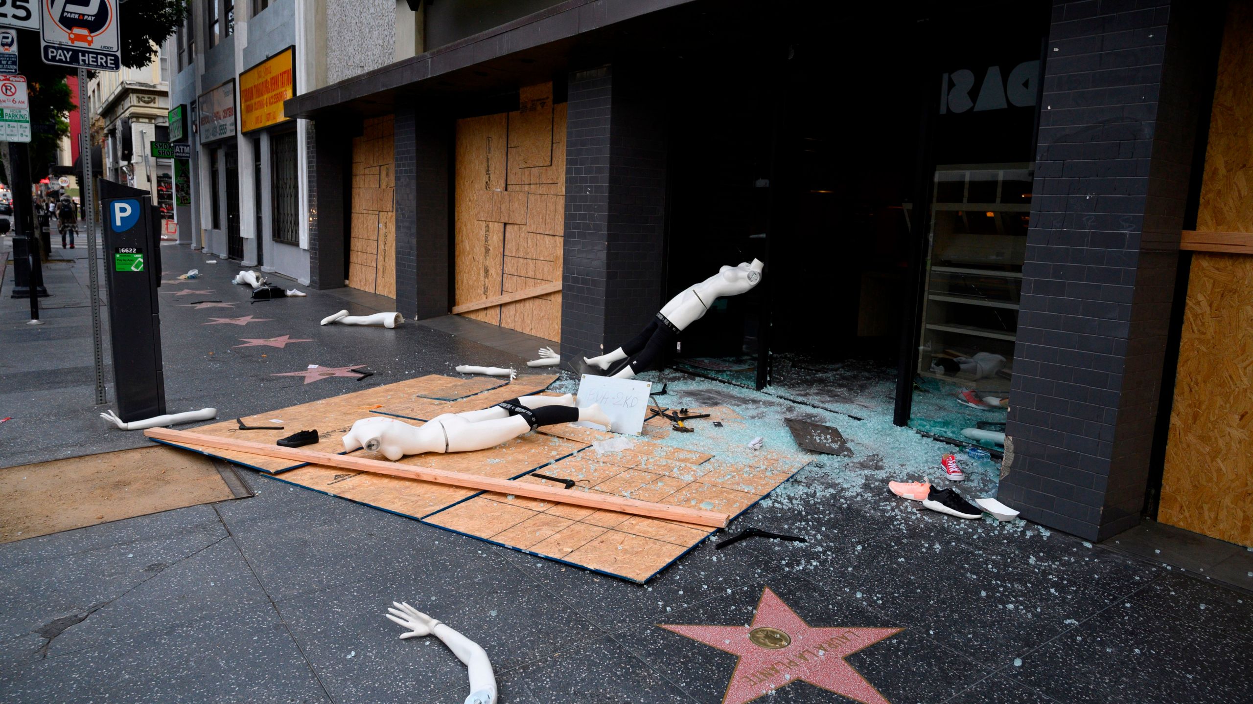 A mannequin is seen on the street after a store was broken into in Hollywood on June 1, 2020, after a third day of protests in California. (Robyn Beck / AFP / Getty Images)