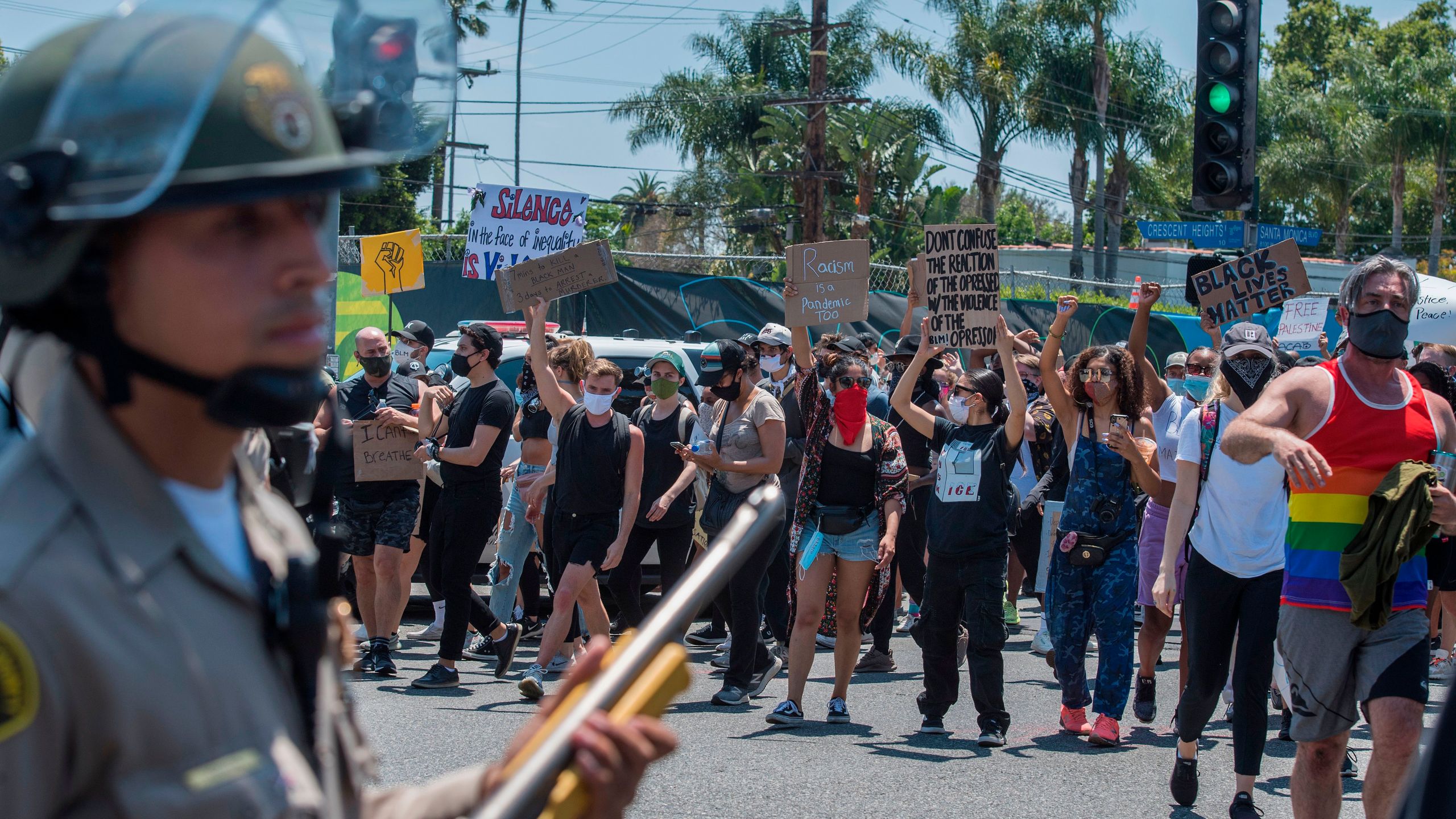 Deputies from the Los Angeles County Sheriff's Department keep watch as demonstrators continue to protest the death of George Floyd in West Hollywood on June 3, 2020. (Mark Ralston / AFP / Getty Images)