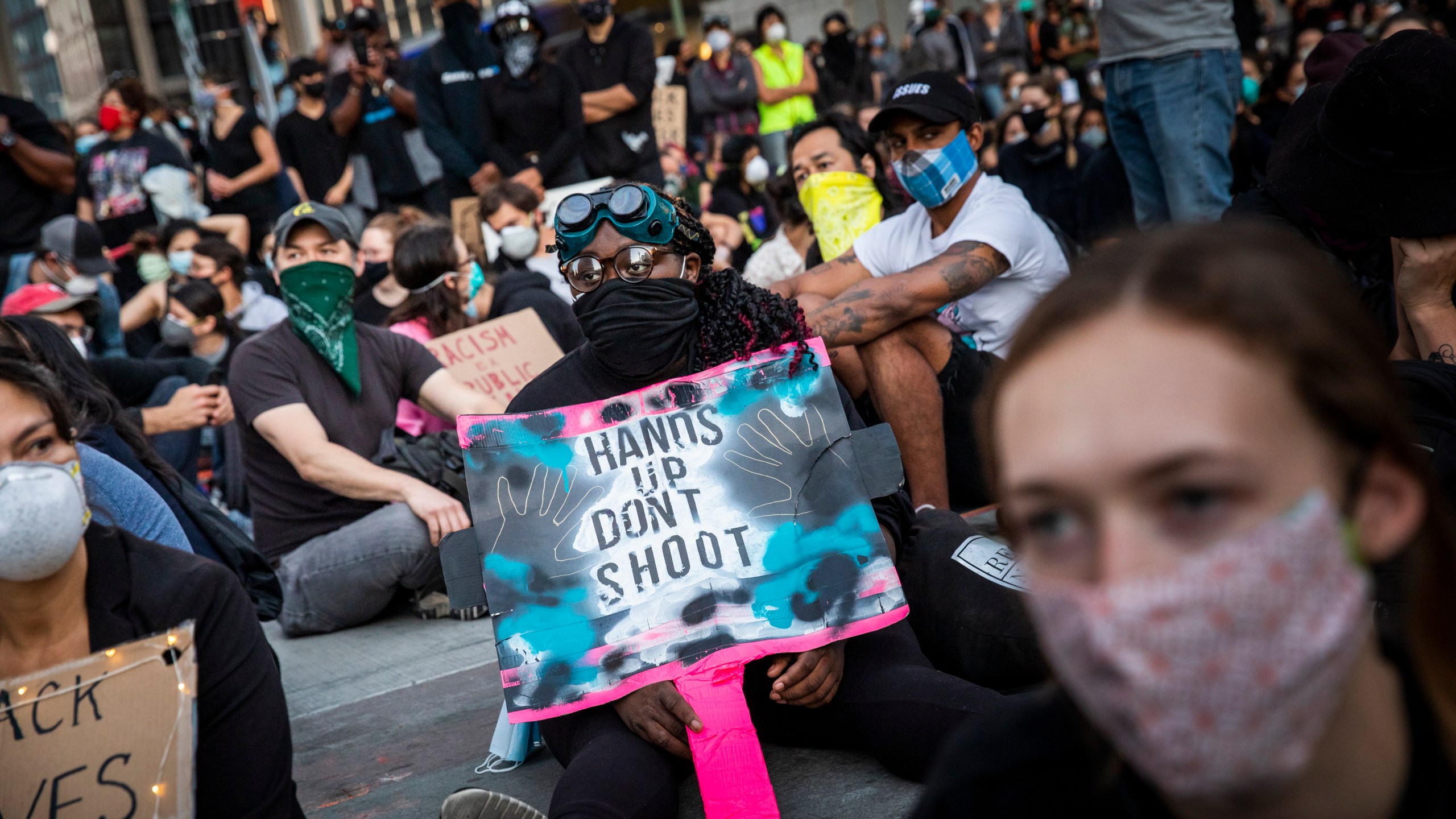 Demonstrators attend a "Sit Out the Curfew" protest against the death of George Floyd who died on May 25 in Minneapolis whilst in police custody, along a street in Oakland, California on June 3, 2020. - US protesters welcomed new charges against Minneapolis officers in the killing of African-American man George Floyd -- but thousands still marched in cities across the country for a ninth straight night, chanting against racism and police brutality. (Photo by Philip Pacheco / AFP) (Photo by PHILIP PACHECO/AFP via Getty Images)