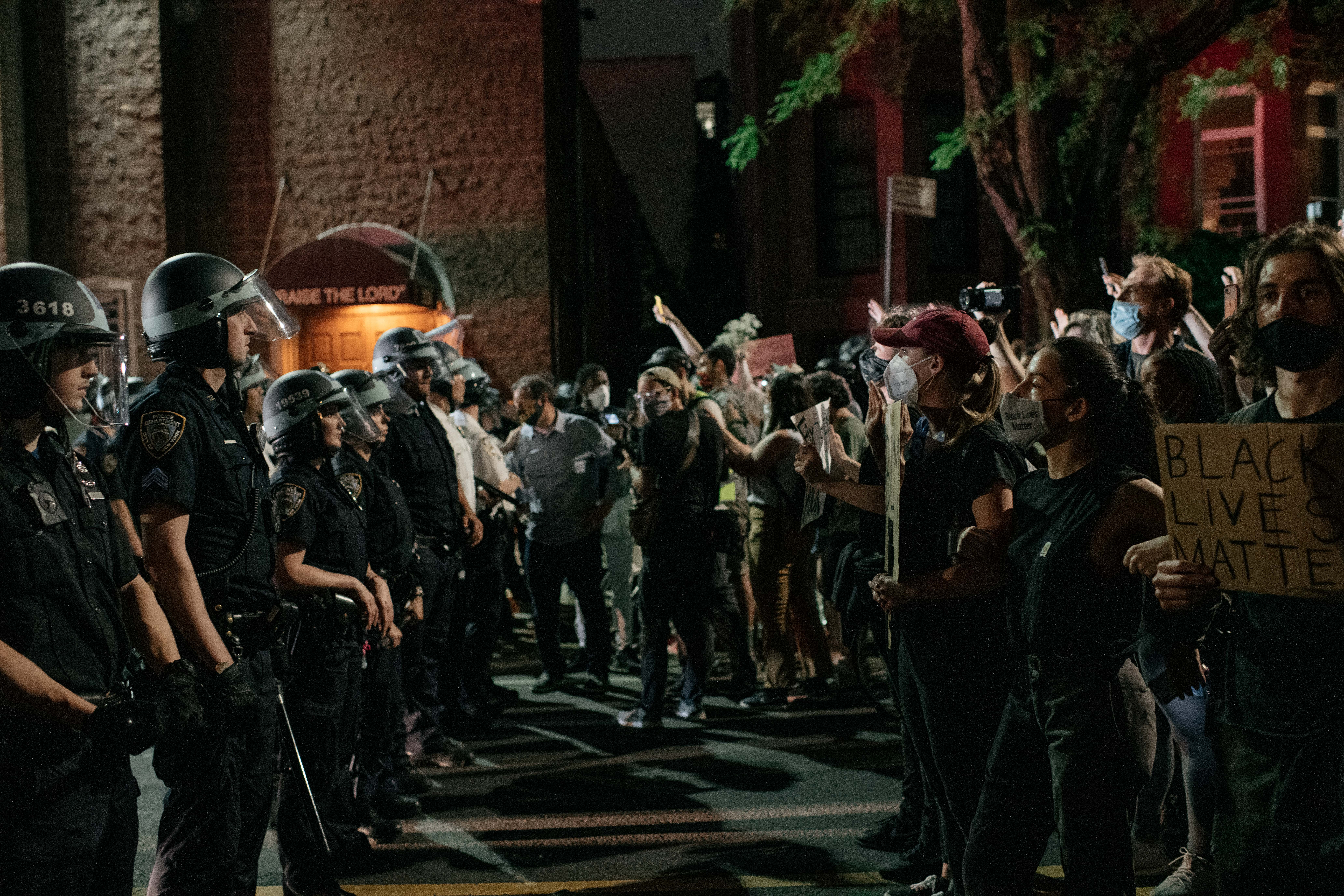 Demonstrators denouncing systemic racism in law enforcement face off with a line of NYPD officers hours after violating a citywide curfew on June 4, 2020 in New York City. (Scott Heins/Getty Images)