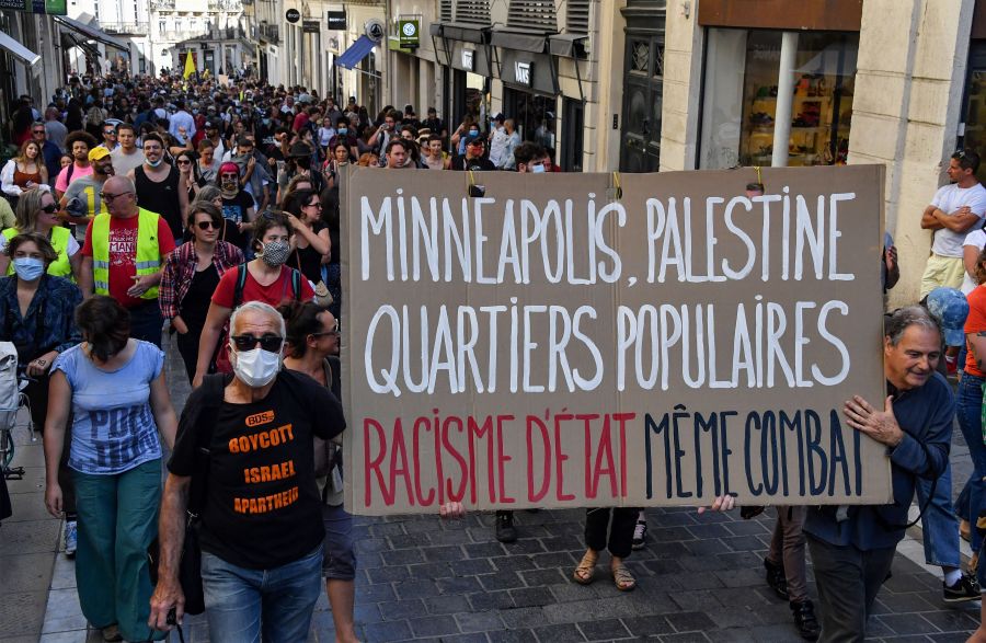 Protestors march with placards during a demonstration on June 13, 2020, in Montpellier, in the south of France, as part of the 'Black Lives Matter' worldwide protests against racism and police brutality. (PASCAL GUYOT/AFP via Getty Images)