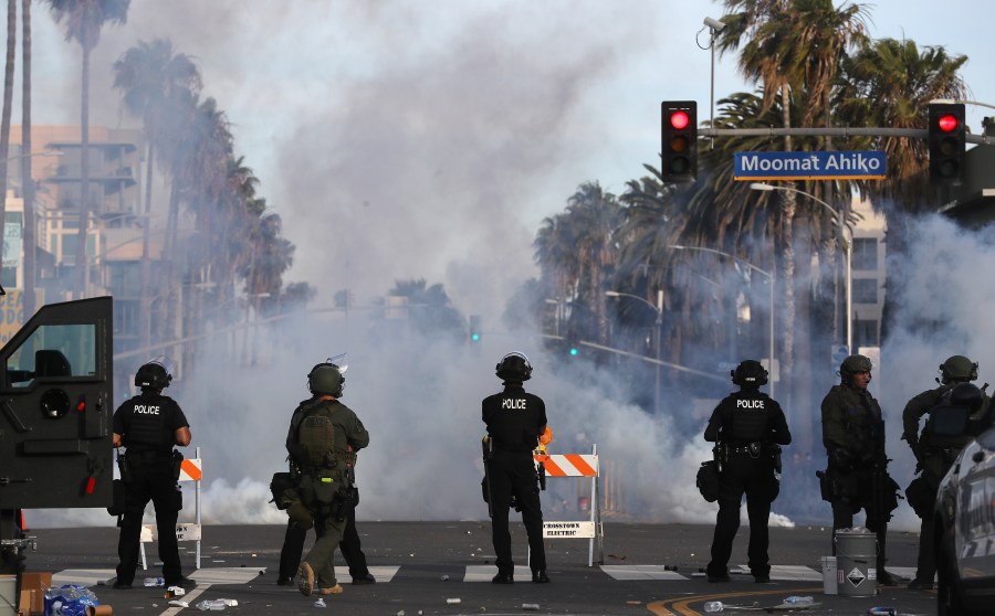 Police watch as tear gas is deployed during demonstrations in Santa Monica following the death of George Floyd on May 31, 2020.(Mario Tama/Getty Images)