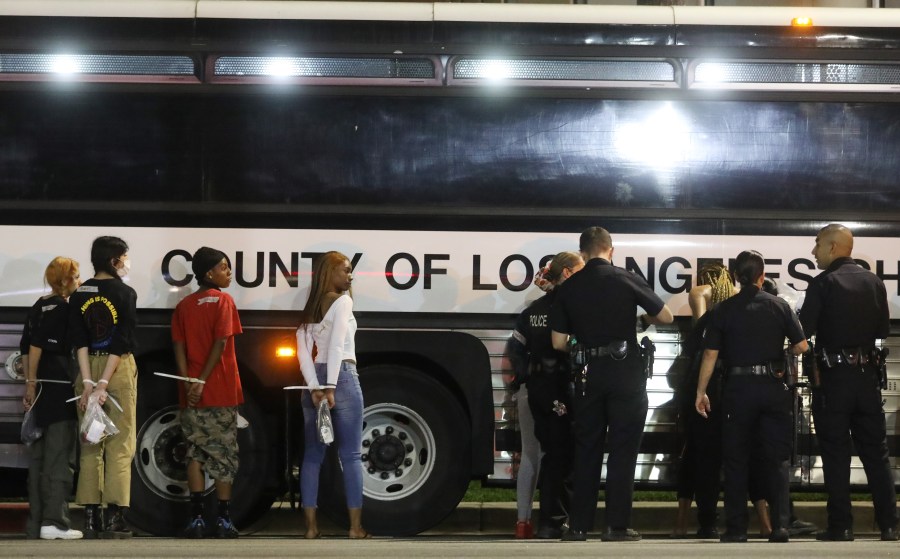 People stand handcuffed by police in the Hollywood area on June 1, 2020 amid demonstrations over George Floyd’s death. (Mario Tama/Getty Images)