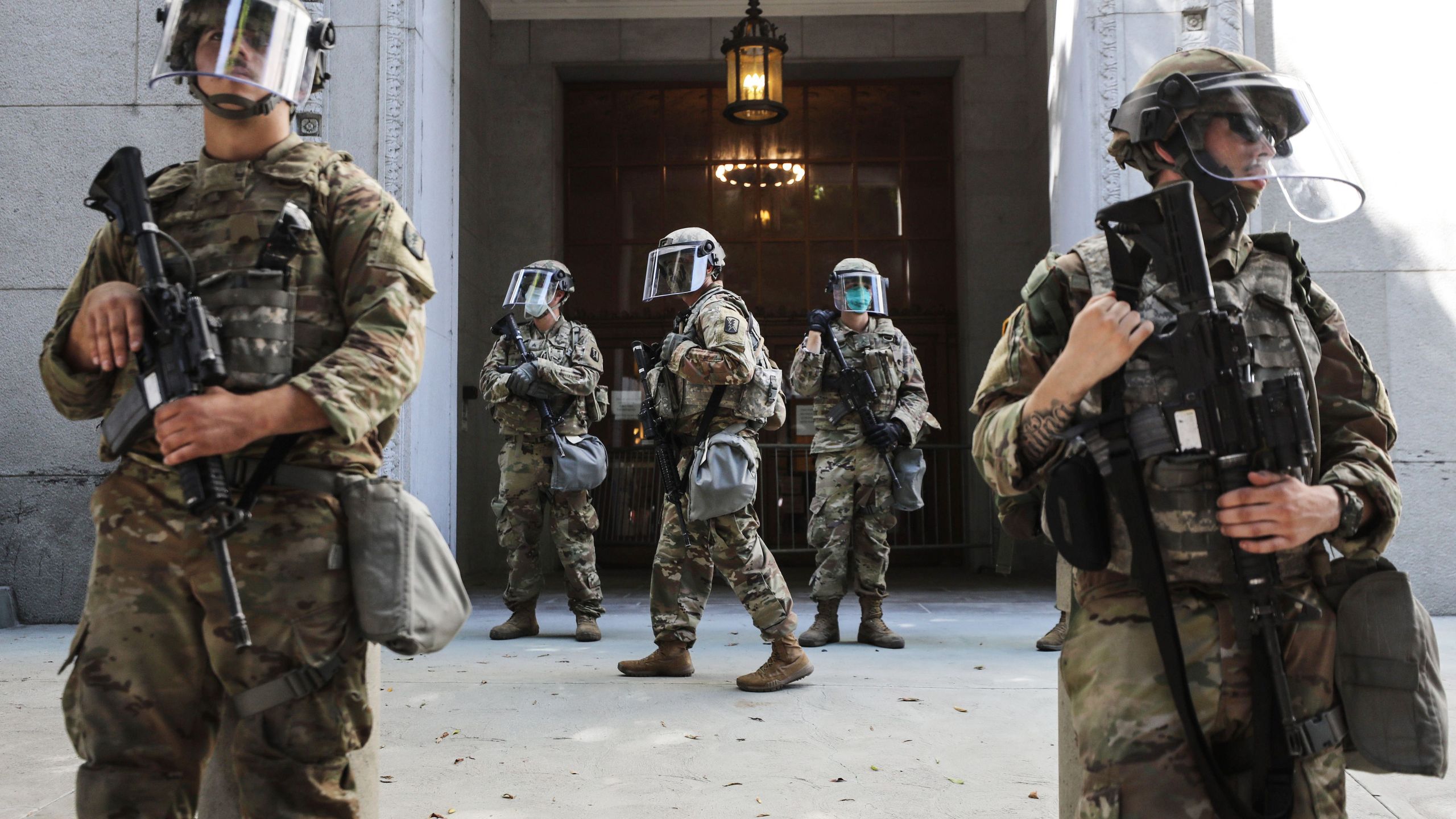 National Guard troops are posted outside the Los Angeles County District Attorney's office during a peaceful demonstration over George Floyd’s death on June 3, 2020. (Mario Tama / Getty Images)