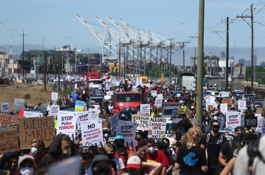 Thousands of protesters march towards downtown Oakland during a Juneteenth rally at the Port of Oakland on June 19, 2020. (Justin Sullivan / Getty Images)