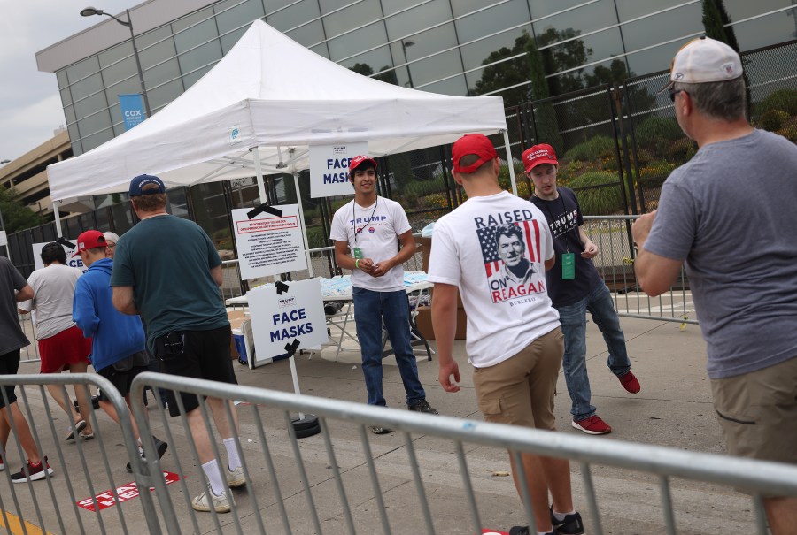 Face masks are handed out ahead of a Trump campaign rally at the BOK Center on June 20, 2020 in Tulsa, Oklahoma. (Win McNamee/Getty Images)