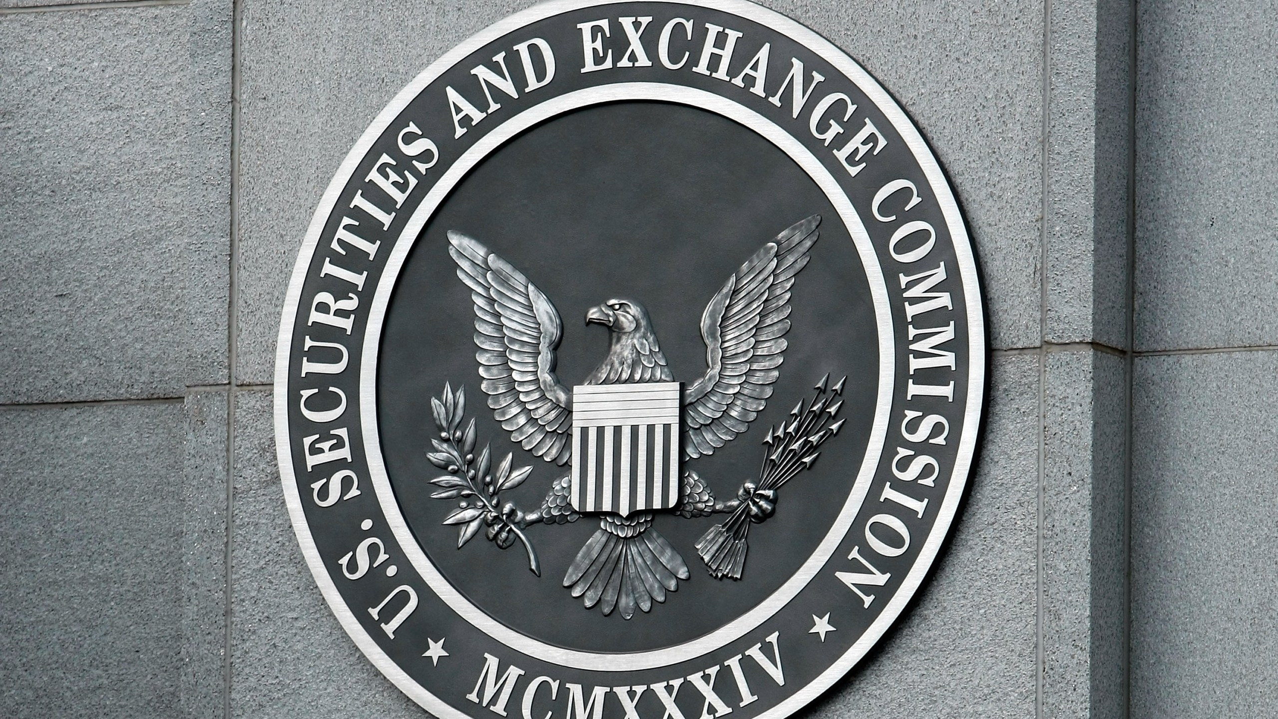 The U.S. Securities and Exchange Commission seal hangs on the facade of its building in Washington, D.C. in this file photo. (Chip Somodevilla/Getty Images)