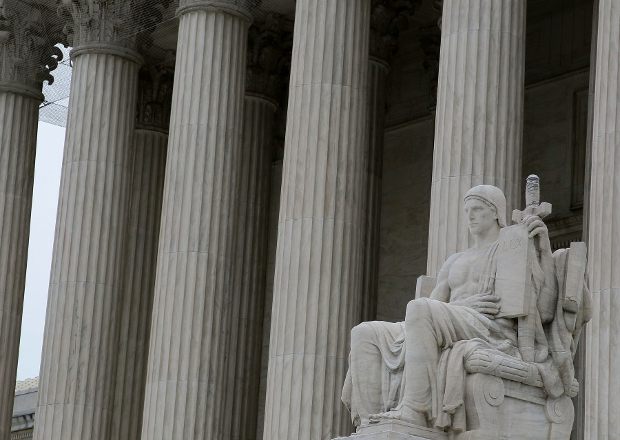 The statue "Authority of Law" by artist James Earle Fraser is seen outside the U.S. Supreme Court Building on March 2, 2010 in Washington, DC. (Mark Wilson/Getty Images)