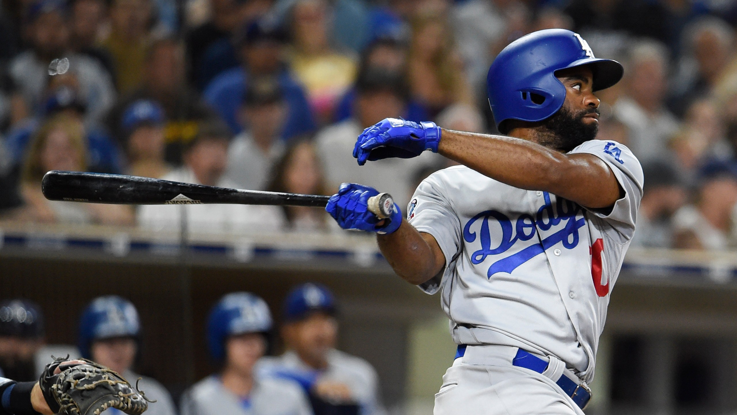 Andrew Toles of the Los Angeles Dodgers hits an RBI single during the seventh inning of a baseball game against the San Diego Padres at Petco Park on July 12, 2018 in San Diego. (Denis Poroy/Getty Images)