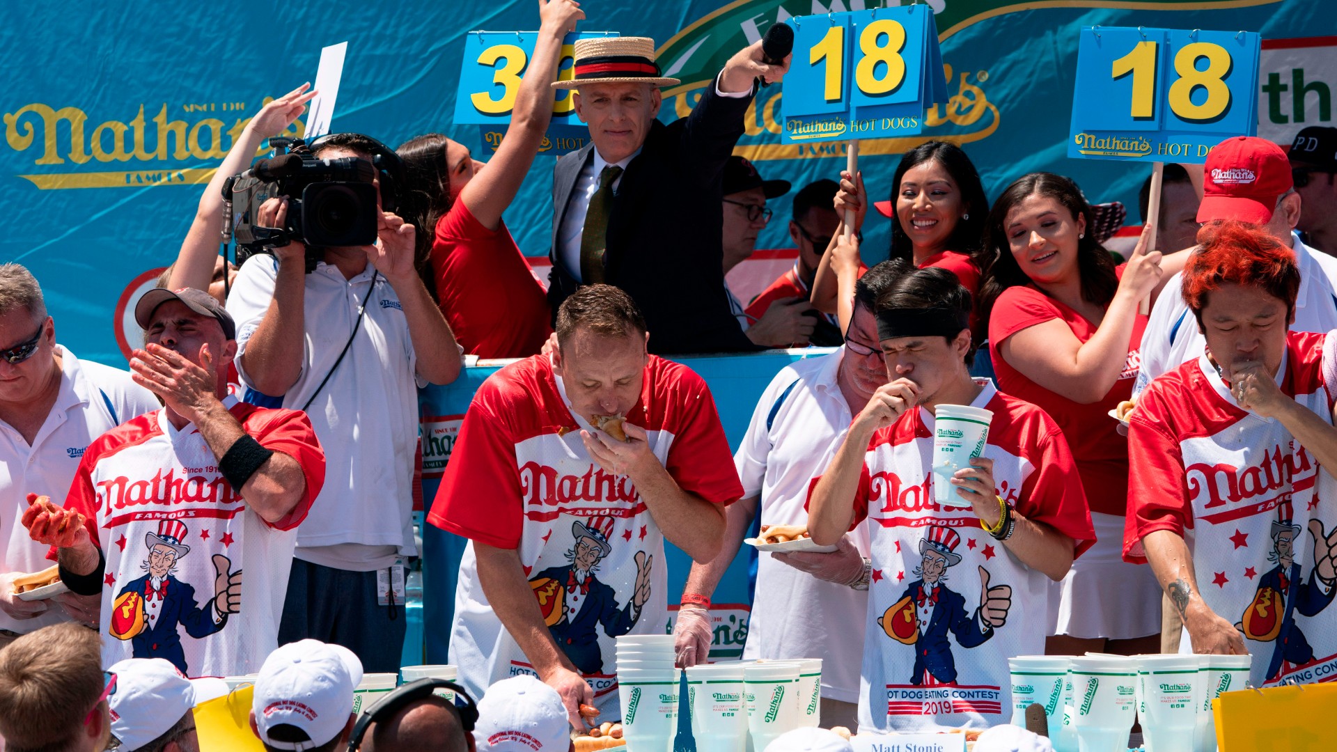 Joey Chestnut, second competitor to the left, won Nathan's Famous Fourth of July hot dog eating contest on Coney Island on July 4, 2019 in New York. (DON EMMERT/AFP via Getty Images)