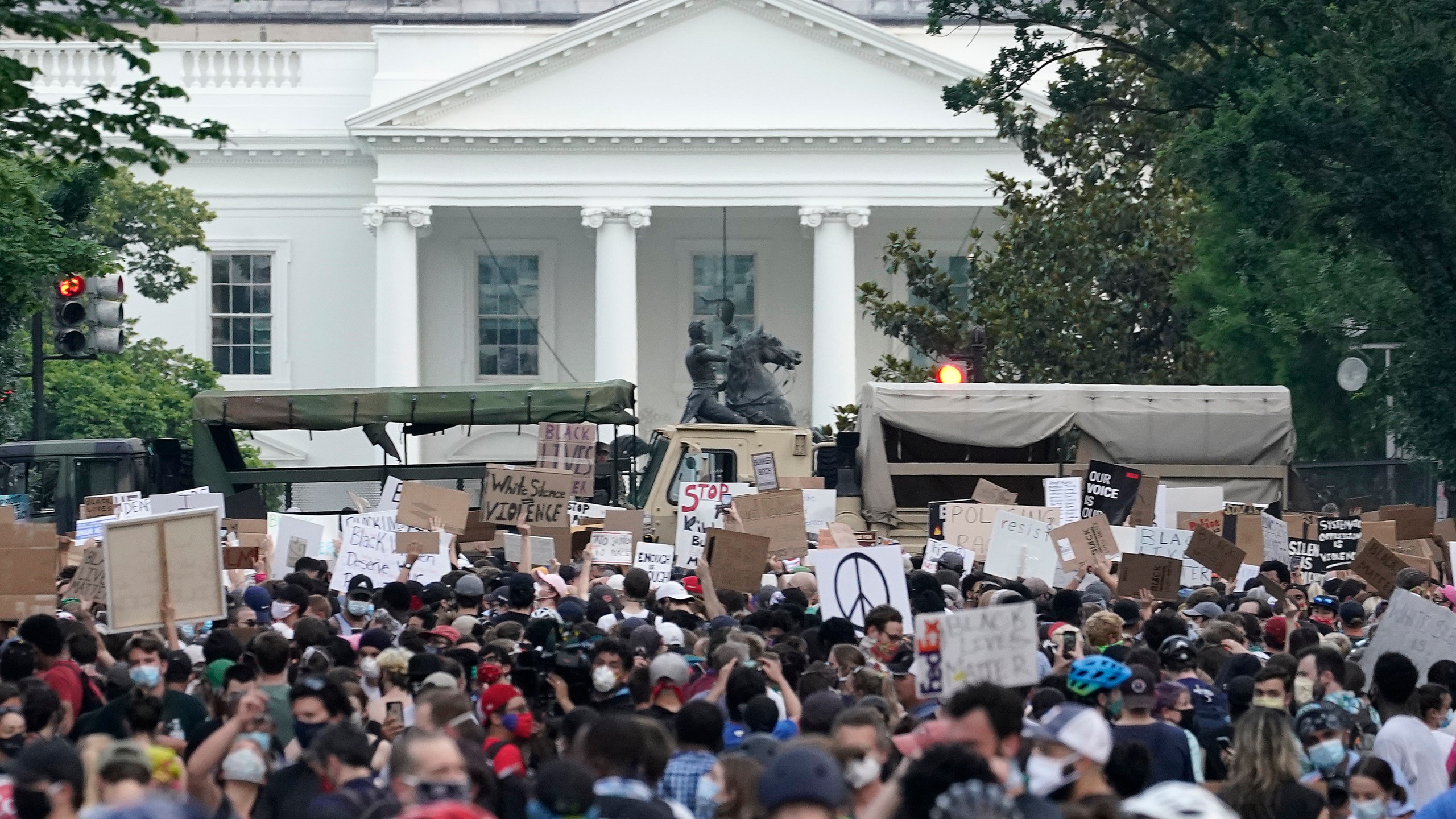 National Guard vehicles are used to block 16th Street near Lafayette Park and the White House as Demonstrators participate in a peaceful protest against police brutality and the death of George Floyd, on June 3, 2020, in Washington, DC. (Drew Angerer/Getty Images)