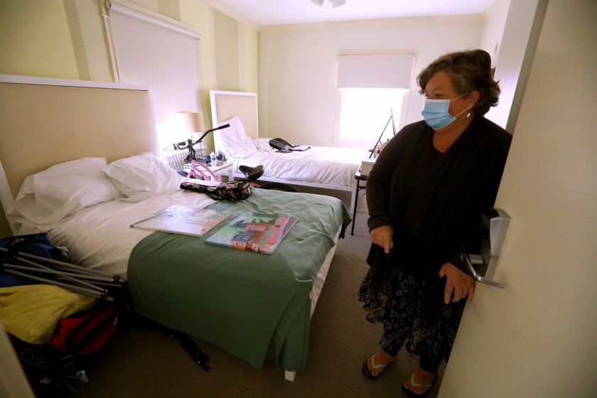 Wendy Brown enters her room at the Cadillac Hotel in Venice on June 1, 2020, as part of Project Roomkey.(Genaro Molina/Los Angeles Times)