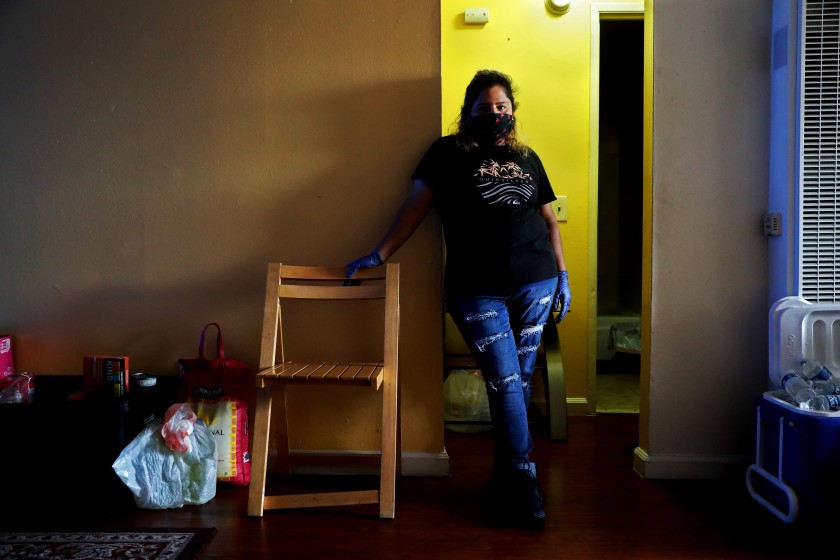 While Claudia Mendez, 42, was finding little work as a house cleaner because of coronavirus restrictions, and then she got COVID-19 herself. Her landlord locked her out, removed her belongings and even took out the toilet. A tenants rights group helped get her back into the apartment for now. (Gary Coronado / Los Angeles Times)