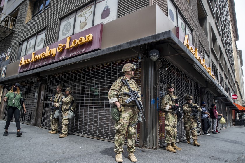 National Guard troops stand guard on June 2, 2020 at the corner of Seventh Street and Broadway as George Floyd protests continue in downtown L.A.. (Robert Gauthier/Los Angeles Times)