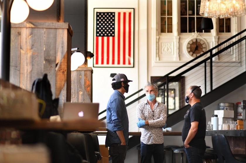 Employees at Finney’s Crafthouse in Ventura are seen in May 2020 as they prepare to reopen. (Wally Skalij / Los Angeles Times)