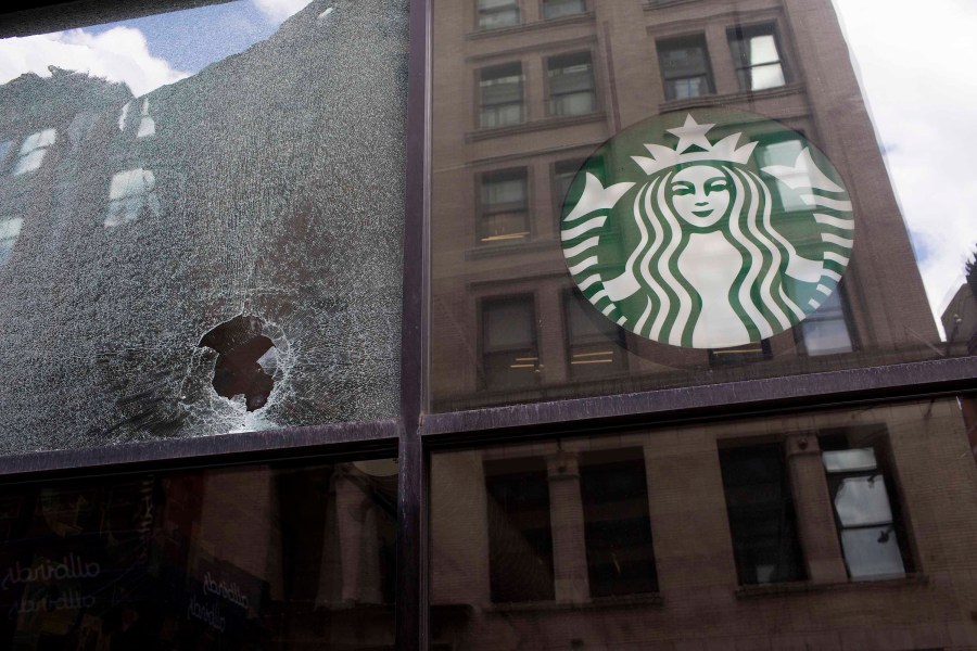 A broken glass of a Starbucks is seen after a protest against the death in Minneapolis police custody of George Floyd at SoHo neighborhood on June 1, 2020 in the Soho neighborhood of New York City. (Andrew Lichtenstein/Corbis via Getty Images)