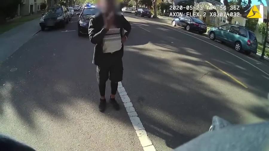 A black man dancing in the street of a Northern California city was pinned to the ground and placed under arrest by police after officers were called to the scene, newly-released officer body cam video shows. His face was blurred by police. (City of Alameda)