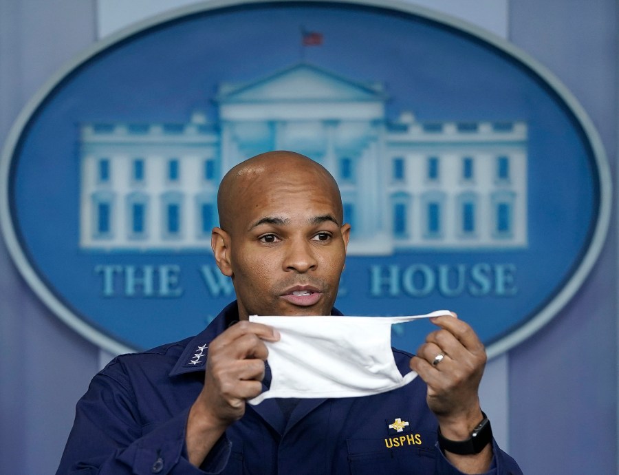 U.S. Surgeon General Jerome Adams holds up his face mask during the daily briefing of the coronavirus task force at the White House on April 22, 2020 in Washington, DC. (Drew Angerer/Getty Images)