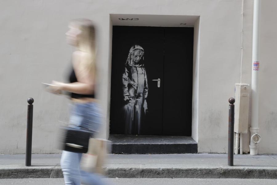 The Banksy artwork, seen here in June 2018, was on a side door of the Bataclan concert hall. (THOMAS SAMSON/AFP/AFP/Getty Images)