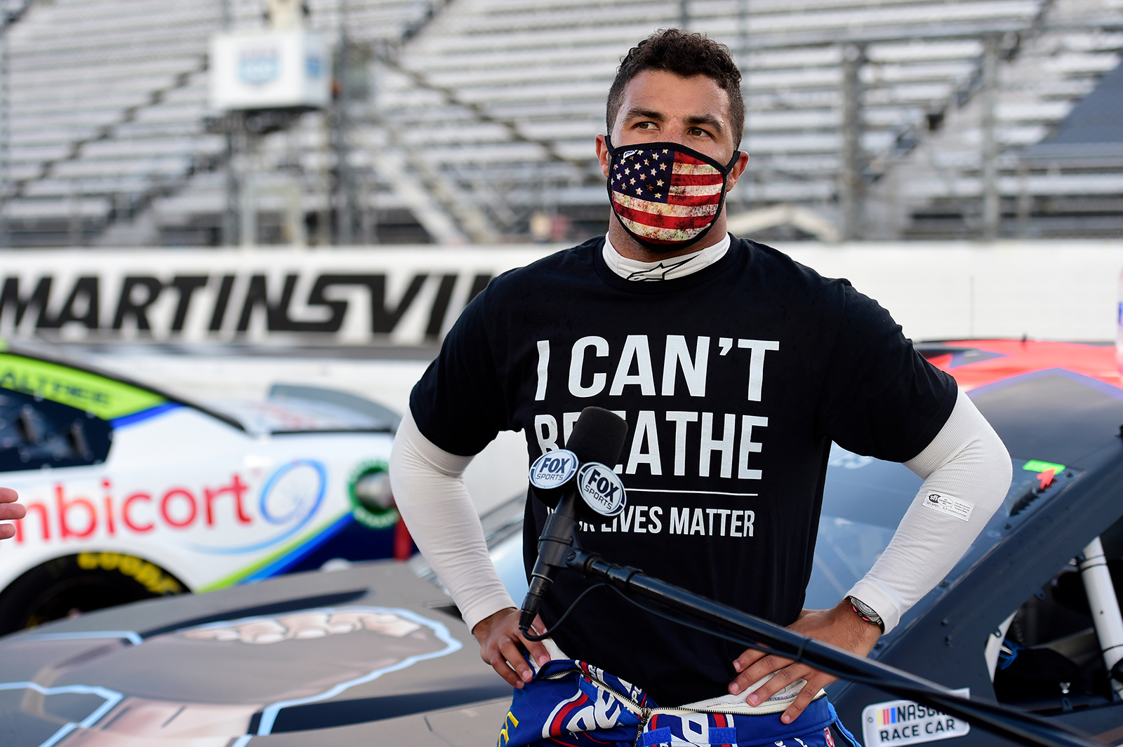 Bubba Wallace, driver of the #43 Richard Petty Motorsports Chevrolet, wears a "I Can't Breathee - Black Lives Matter" t-shirt under his fire suit in solidarity with protesters around the world taking to the streets after the death of George Floyd on May 25, speaks to the media prior to the NASCAR Cup Series Blue-Emu Maximum Pain Relief 500 at Martinsville Speedway on June 10, 2020 in Martinsville, Virginia. (Jared C. Tilton/Getty Images)