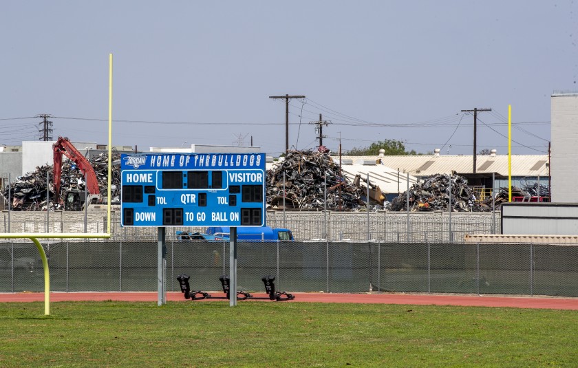 Mounds of debris at Atlas Iron & Metal Co., a metal recycler that operates adjacent to Jordan High School in South Los Angeles, is seen in an undated photo. (Allen J. Schaben/Los Angeles Times)