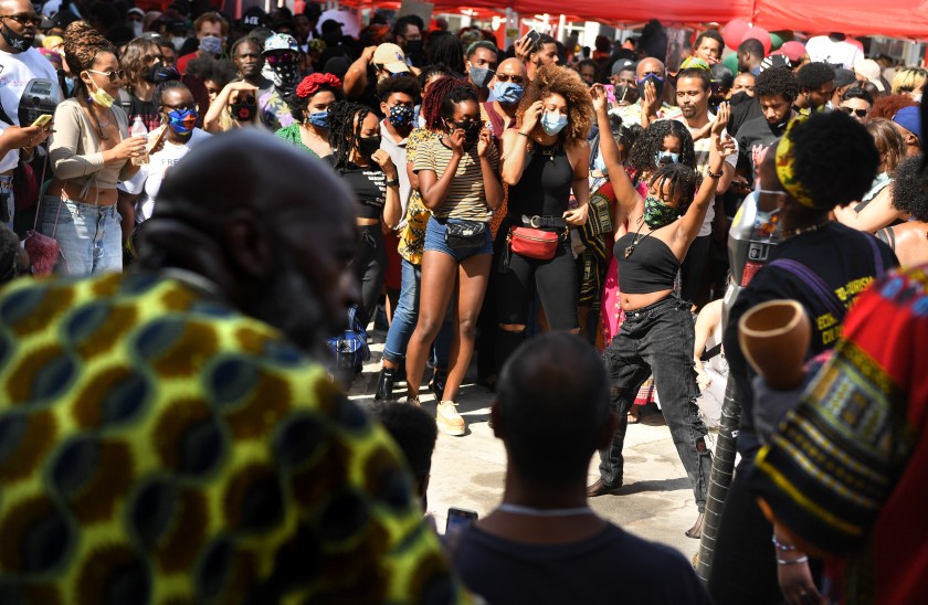 People dance at a Juneteenth celebration in Leimert Park on June 19, 2020. (Wally Skalij / Los Angeles Times)