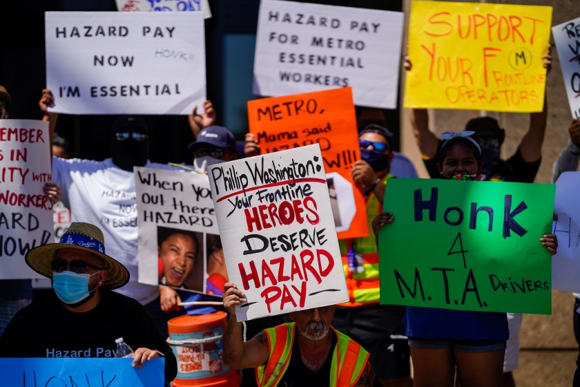 At a protest outside L.A. Metro headquarters on July 10, 2020, bus drivers demand hazard pay for working during the COVID-19 pandemic.(Kent Nishimura / Los Angeles Times)