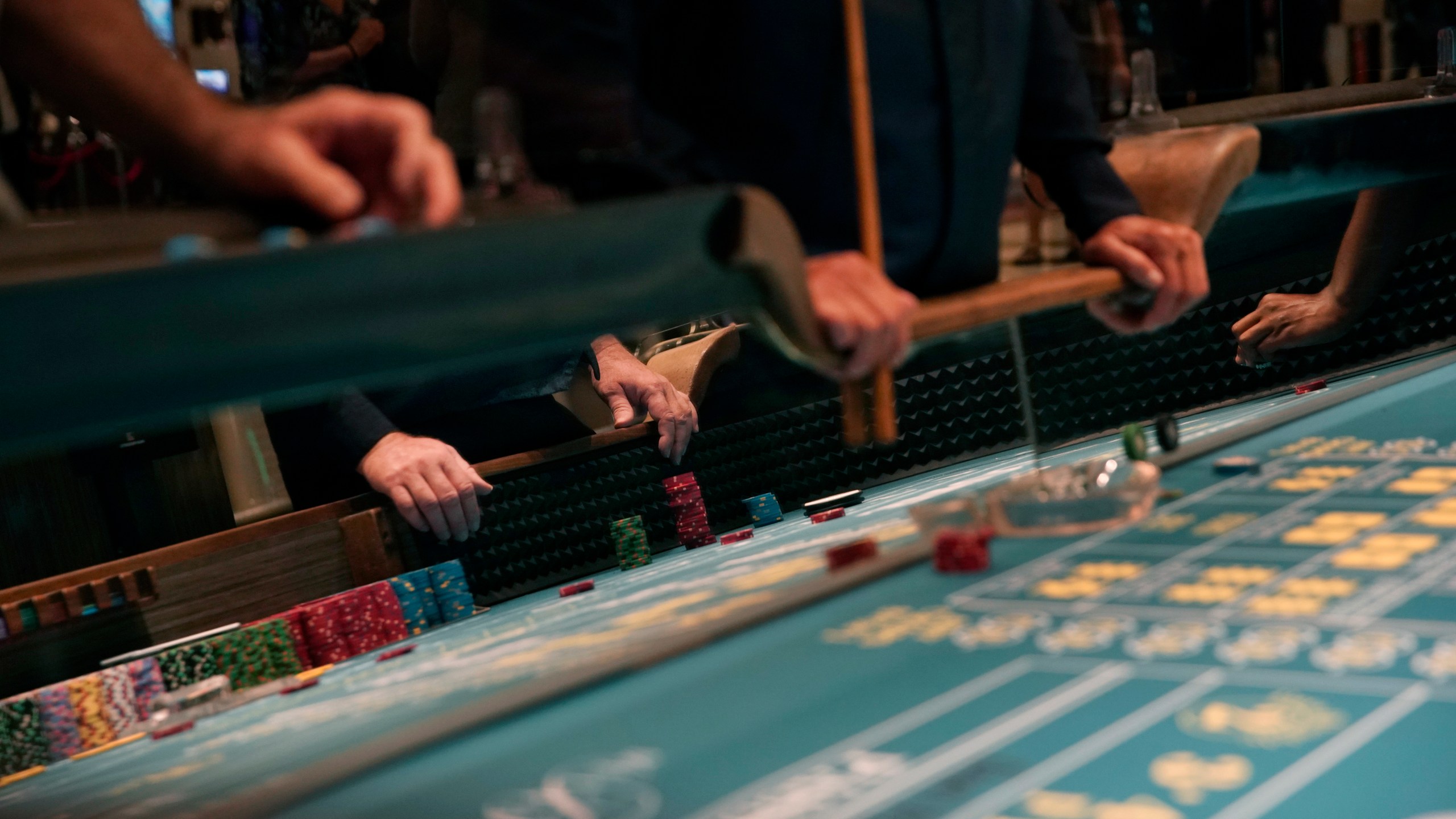 People play craps after the reopening of the Bellagio hotel and casino in Las Vegas on June 4, 2020. (John Locher / Associated Press)