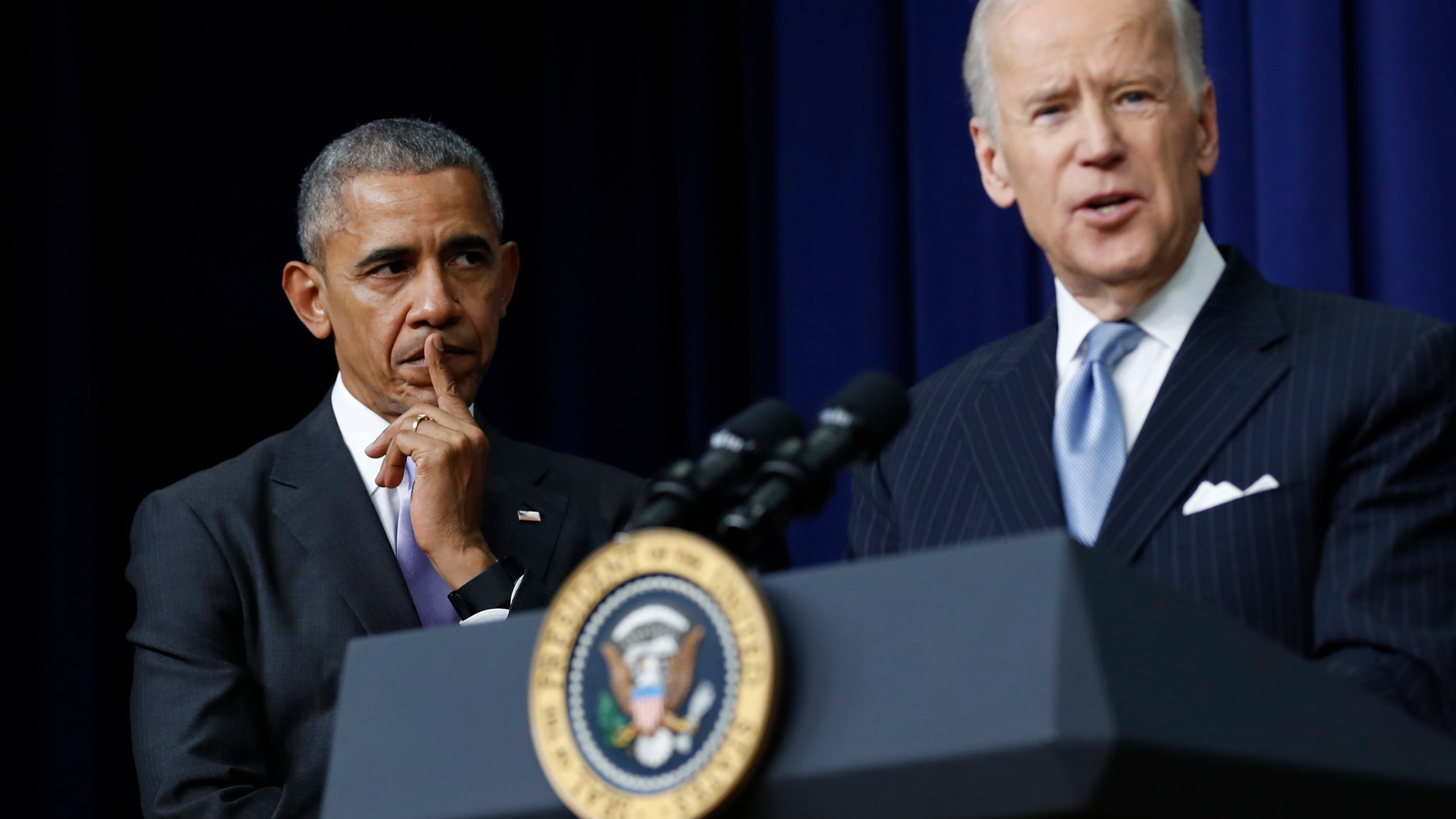 In this Dec. 13, 2016, file photo, President Barack Obama listens as Vice President Joe Biden speaks in the South Court Auditorium in the Eisenhower Executive Office Building on the White House complex in Washington. (AP Photo/Carolyn Kaster, File)