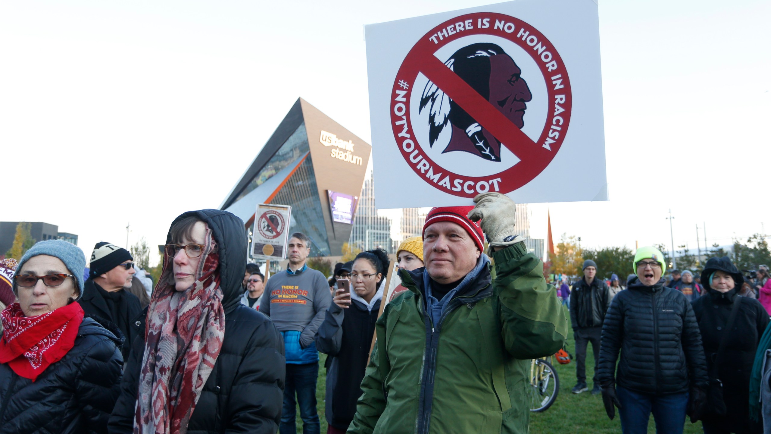 In this Oct. 24, 2019, file photo, Native American leaders protest against the Redskins team name outside U.S. Bank Stadium before an NFL football game between the Minnesota Vikings and the Washington Redskins in Minneapolis. (Bruce Kluckhohn/Associated Press)