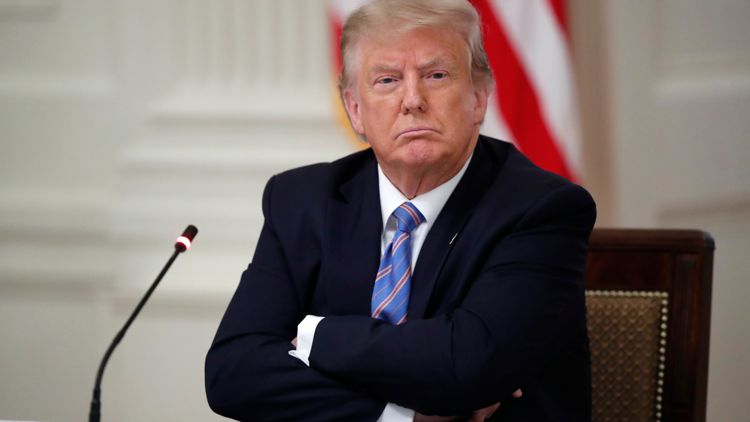 Donald Trump listens during a "National Dialogue on Safely Reopening America's Schools," event in the East Room of the White House on July 7, 2020. (Alex Brandon/Associated Press)