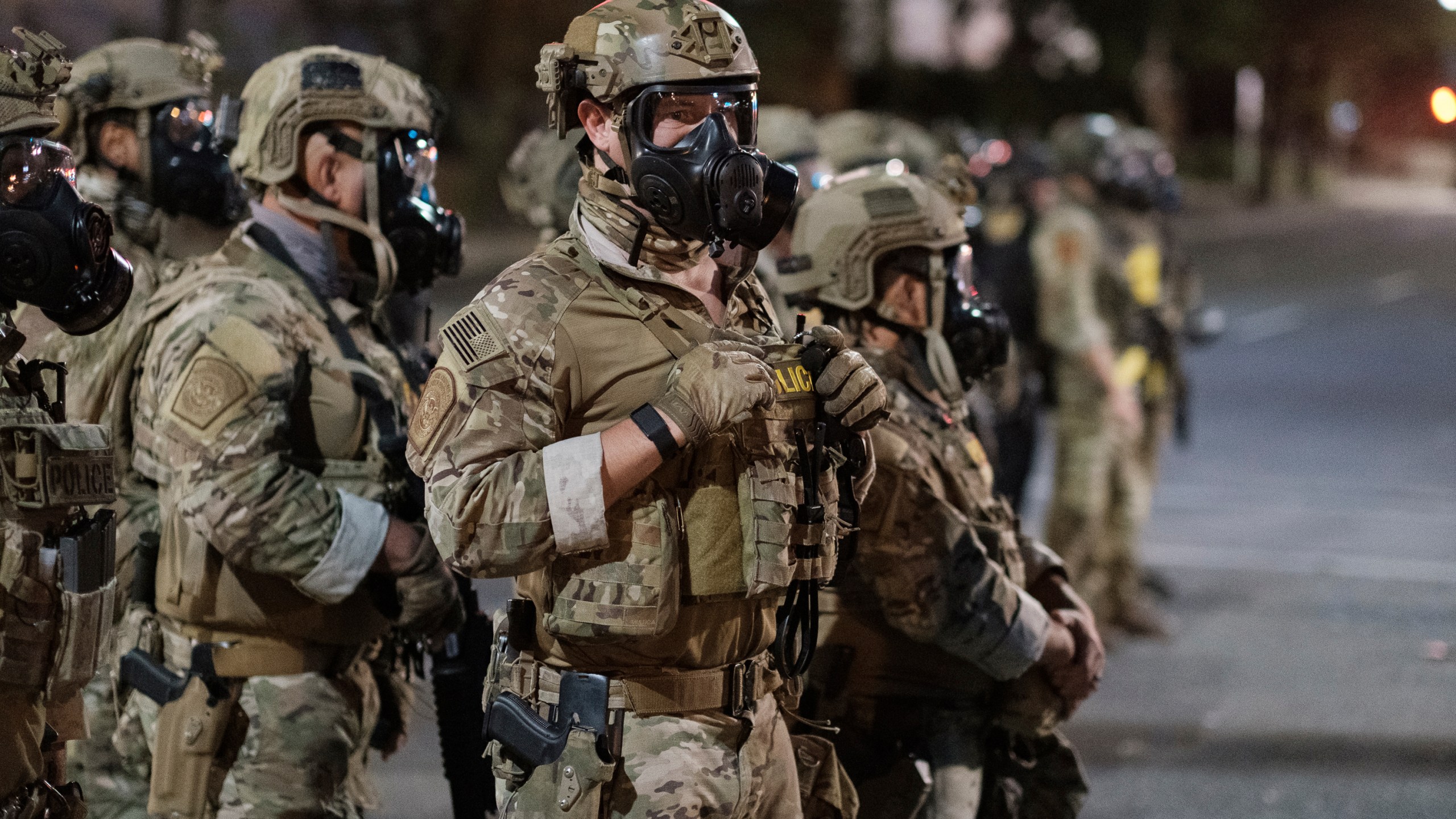 In this photo provided by Doug Brown, agents from different components of the Department of Homeland Security are deployed to protect a federal courthouse in Portland, Oregon, on July 5, 2020. (Doug Brown via Associated Press)