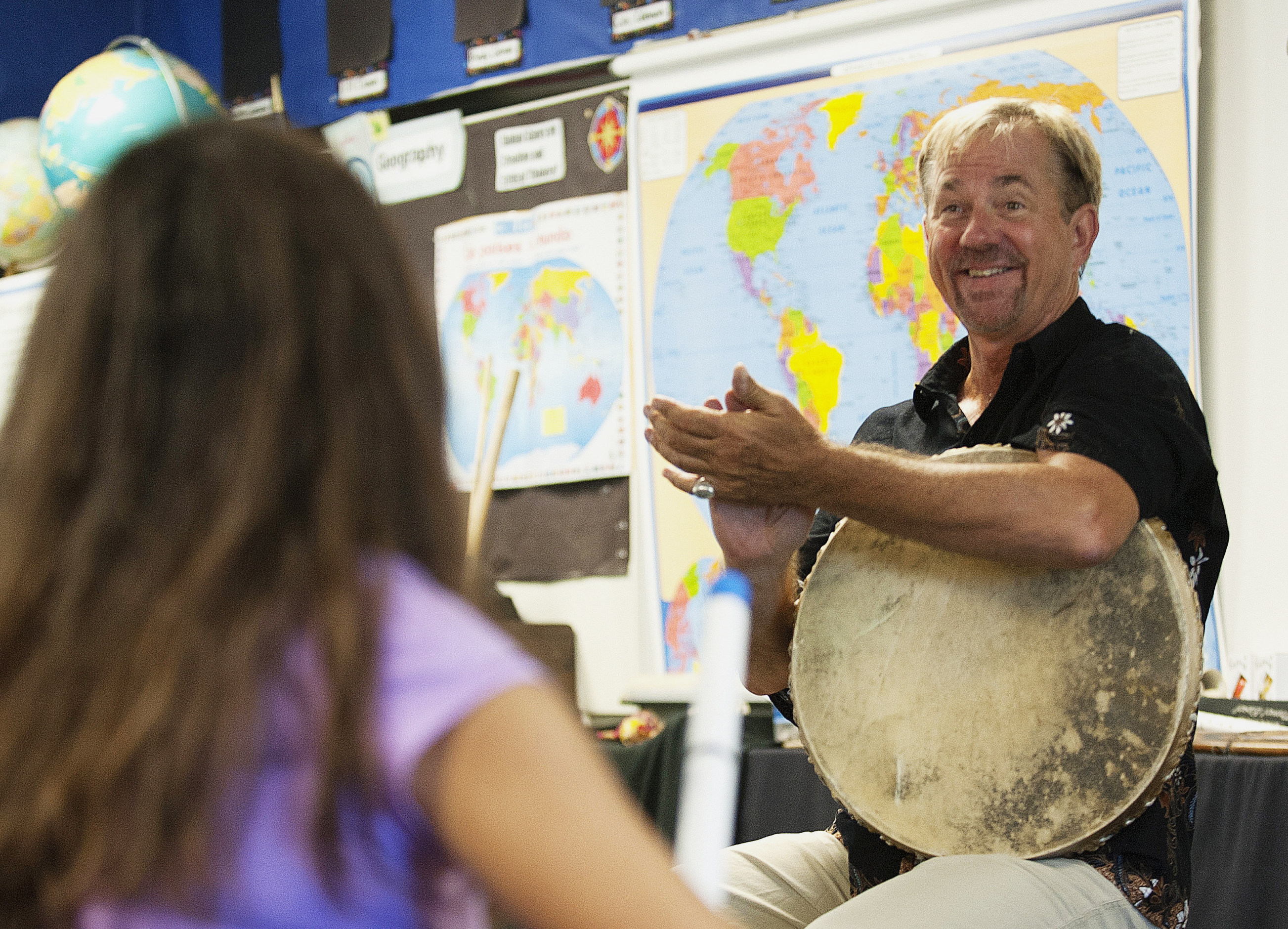 In this 2016 file photo, music teacher John Zeretzke, right, applauds his students after they performed a piece with flutes they built in his class in Lake Forest, Calif. Zeretzke, the founder of an international music program who was accused of giving semen-tainted flutes to California elementary school students, was sentenced to 18 years in state prison, the state attorney's office said Wednesday, July 8, 2020. (Nick Koon/The Orange County Register via Associated Press)