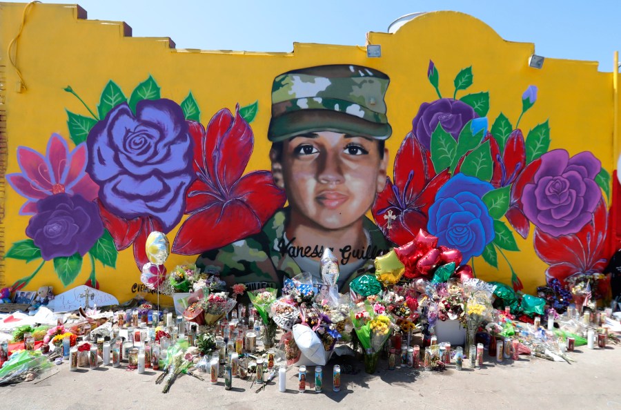 Offerings sit in front of a mural of slain Army Spc. Vanessa Guillen painted on a wall in the south side of Fort Worth, Texas on July 11, 2020. (AP Photo/LM Otero)