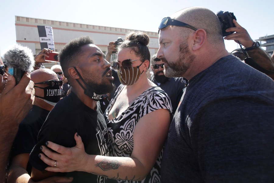 Two people confront each other during a protest calling for an end to racial injustice in Martinez on July 12, 2020. (AP Photo/Jeff Chiu)