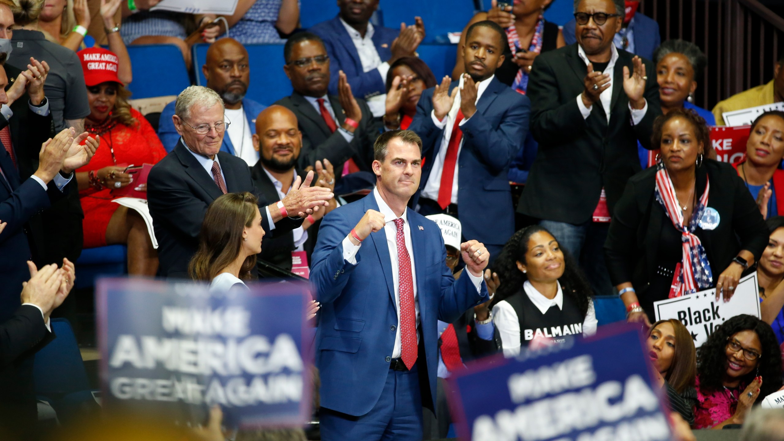 In this June 20, 2020 photo, Oklahoma Gov. Kevin Stitt is recognized as President Donald Trump speaks during a campaign rally at the BOK Center, in Tulsa, Okla. (AP Photo/Sue Ogrocki, File)