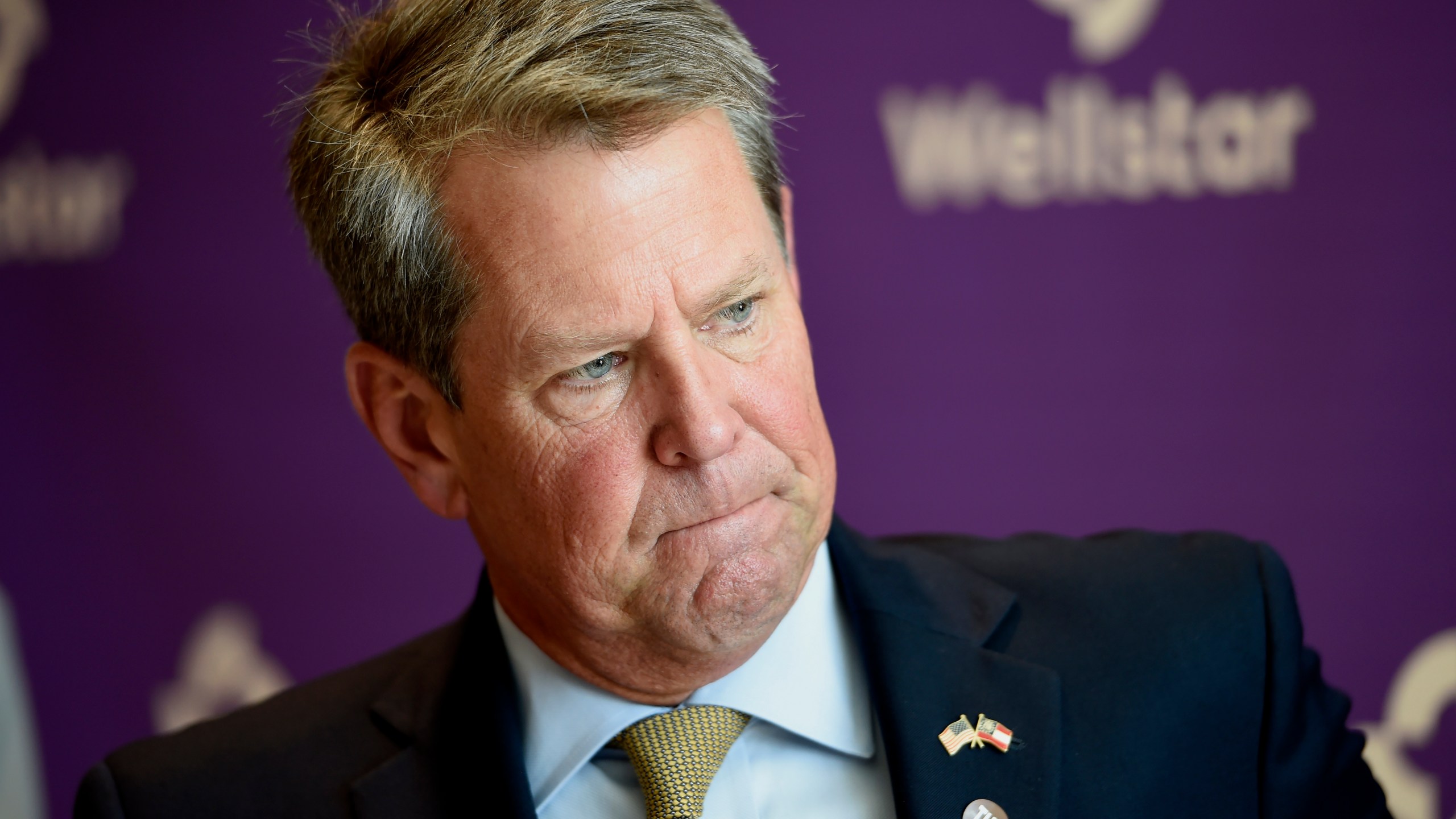 Georgia Gov. Brian Kemp prepares to sign House and Senate bills at Wellstar Kennestone Hospital in Marietta on July 16, 2020. (Mike Stewart / Associated Press)