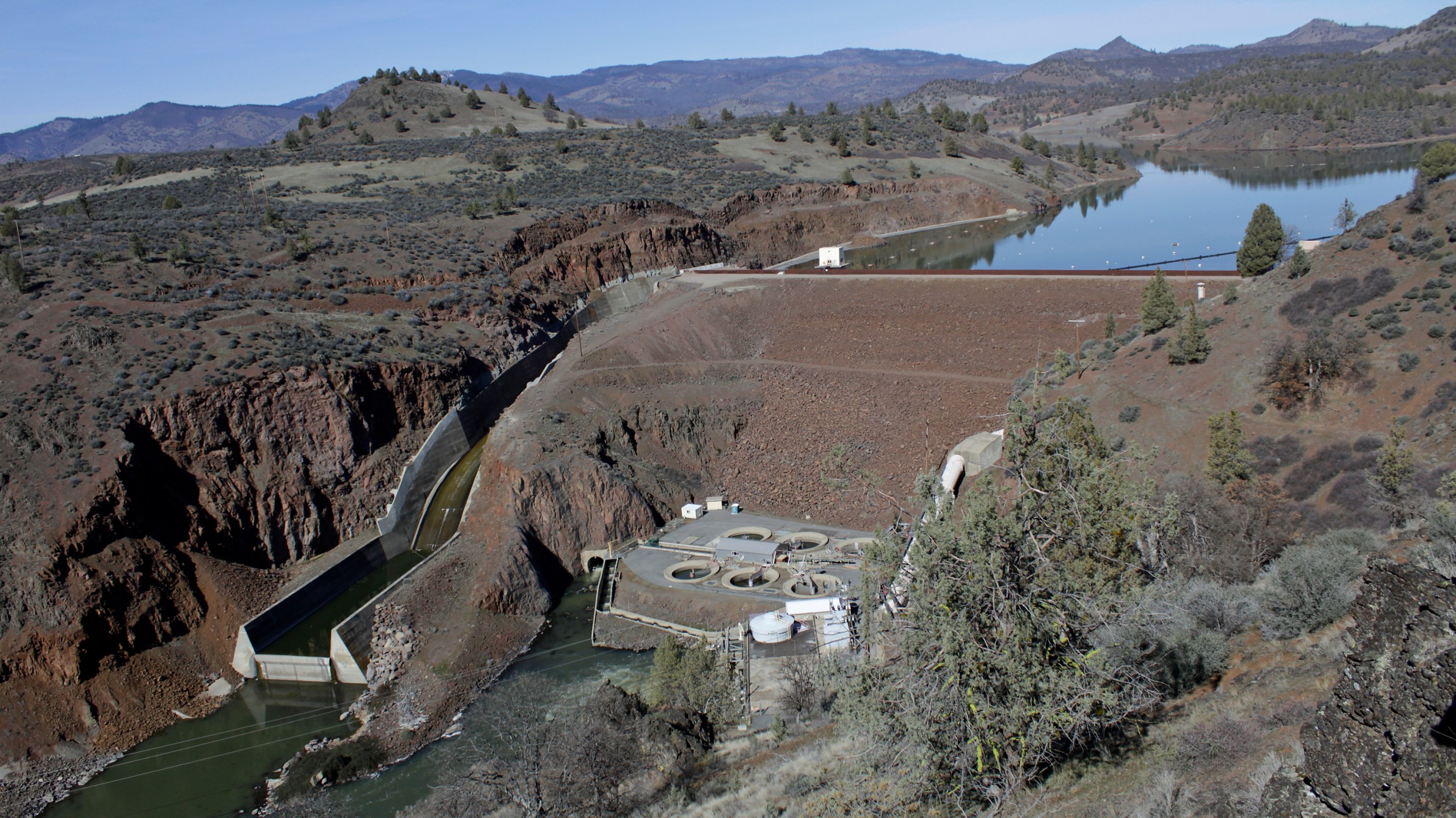 This March 3, 2020, file photo shows the Iron Gate Dam, powerhouse and spillway are on the lower Klamath River near Hornbrook, California. (AP Photo/Gillian Flaccus, File)