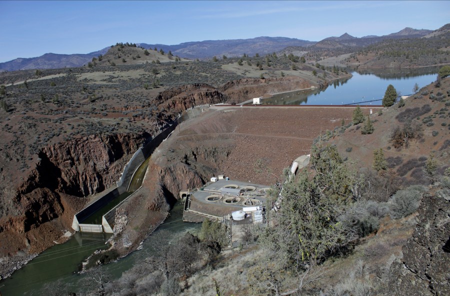 This March 3, 2020, file photo shows the Iron Gate Dam, powerhouse and spillway are on the lower Klamath River near Hornbrook, California. (AP Photo/Gillian Flaccus, File)