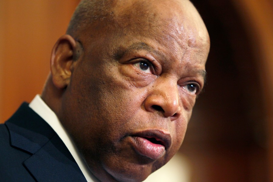 This June 16, 2010 file photo, Rep. John Lewis, D-Ga., participates in a ceremony to unveil two plaques recognizing the contributions of enslaved African Americans in the construction of the United States Capitol on Capitol Hill in Washington. A statue of the late congressman and civil rights leader could soon represent Georgia in the National Statuary Hall of the U.S. Capitol. A bipartisan resolution introduced Wednesday, Jan. 13, 2021 in the Georgia House seeks to replace a statue of Alexander Stephens, a slave owner and vice president of the Confederacy. (AP Photo/Carolyn Kaster, File)