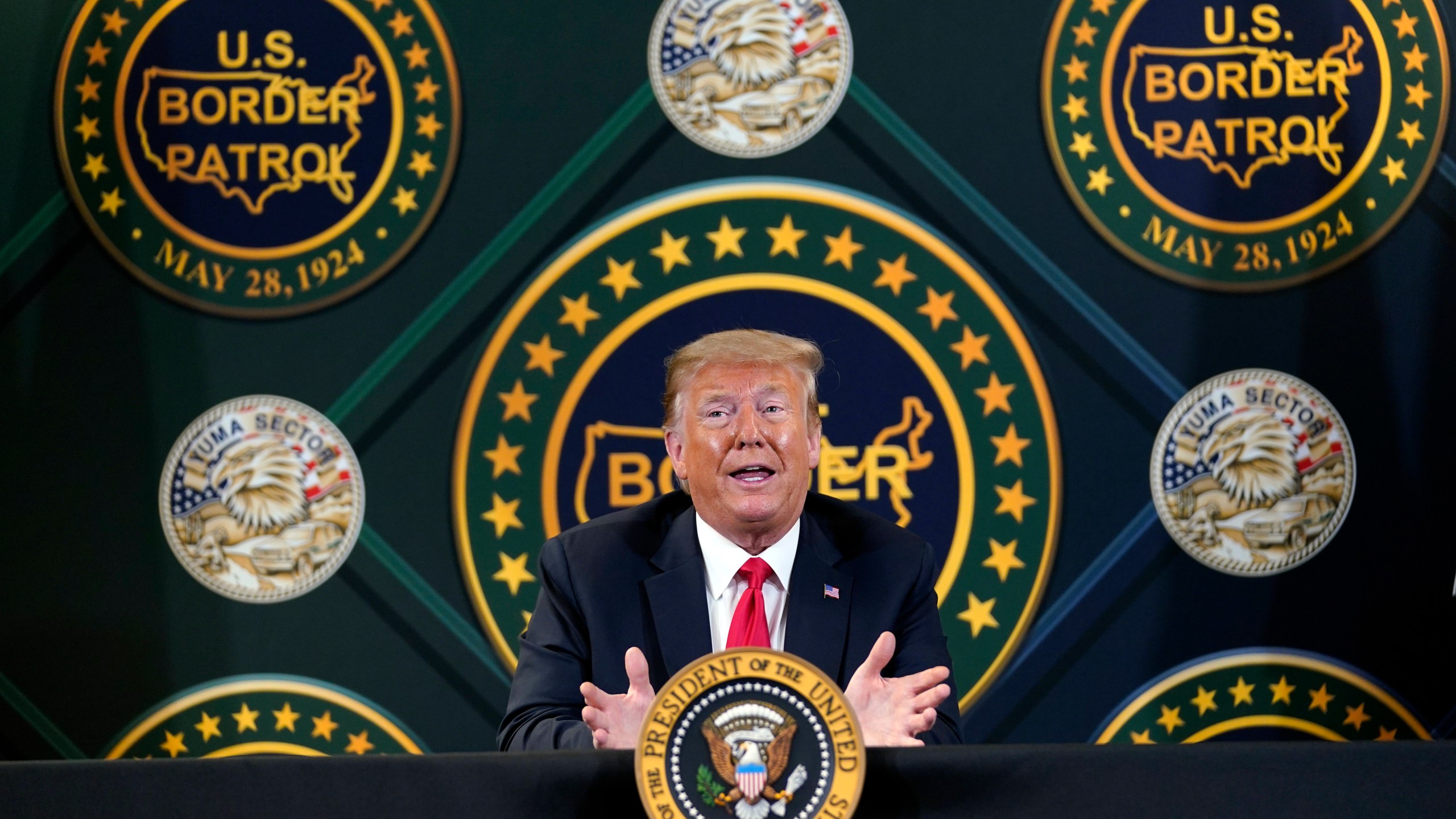 In this June 23, 2020 file photo, Donald Trump participates in a border security briefing at United States Border Patrol Yuma Station in Yuma, Ariz. (AP Photo/Evan Vucci, File)