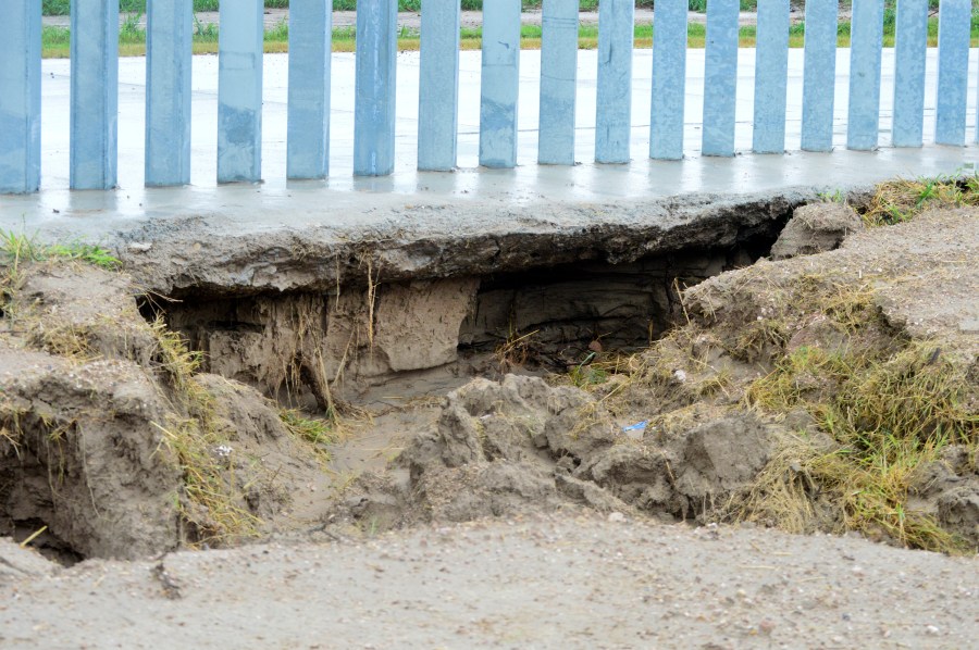 This July 26, 2020 photo provided by the National Butterfly Center shows damage caused by Tropical Storm Hanna at the Fisher border wall, a privately funded border fence on the Rio Grande River near Mission, Texas. The wall was built by a construction company that's won $1.3 billion in U.S. government contracts and promoted by supporters of President Donald Trump. (The National Butterfly Center via AP)