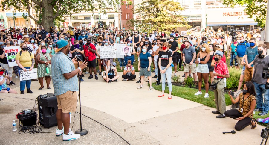 Vauhxx Booker speaks to the hundreds gathered at the Monroe County courthouse on July 6, 2020, in Bloomington, Indiana. (Rich Janzaruk / The Herald-Times via Associated Press)