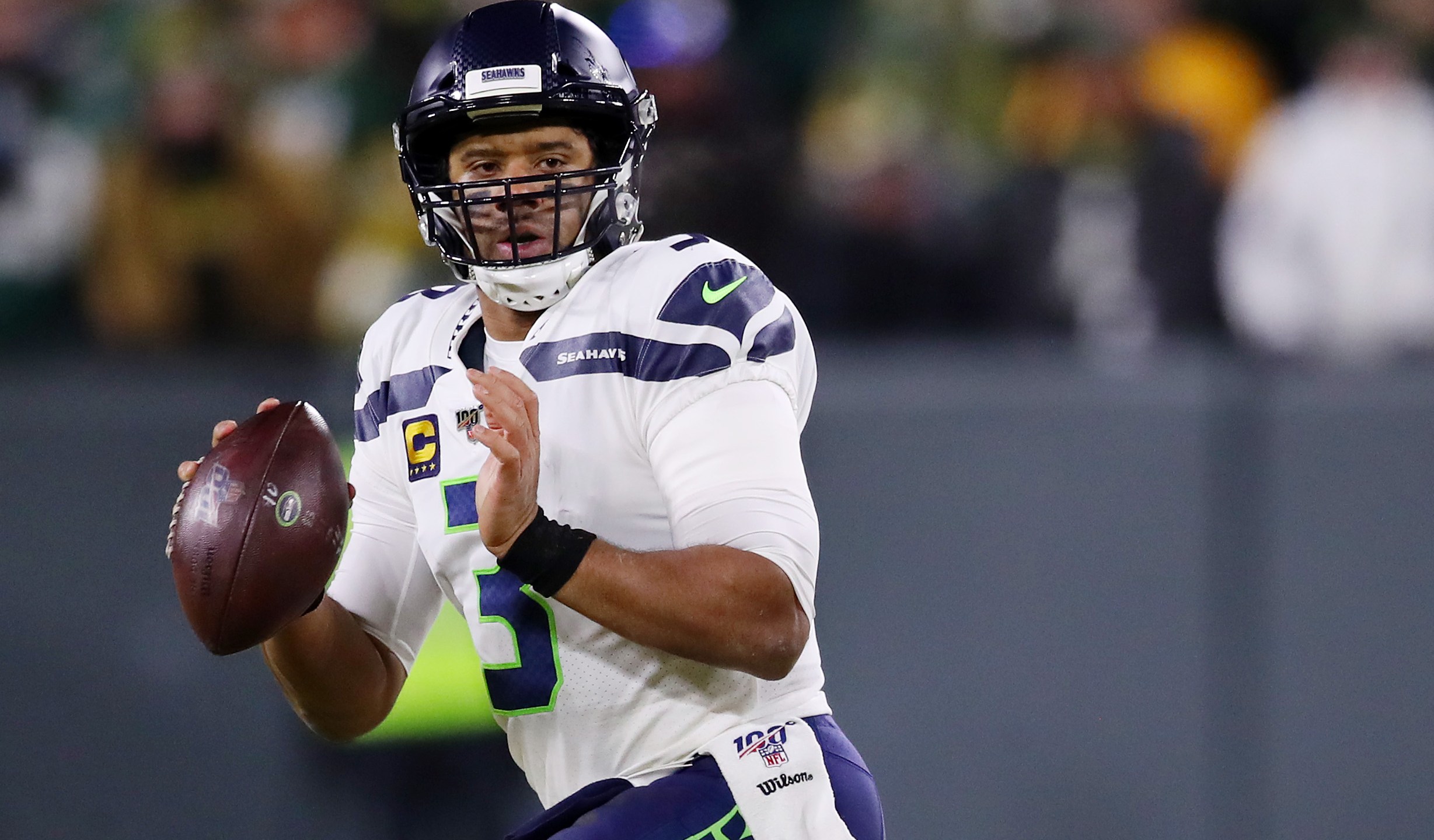 Russell Wilson of the Seattle Seahawks looks to pass during the first half against the Green Bay Packers in the NFC Divisional Playoff game at Lambeau Field on Jan. 12, 2020 in Green Bay, Wisconsin. (Gregory Shamus/Getty Images)