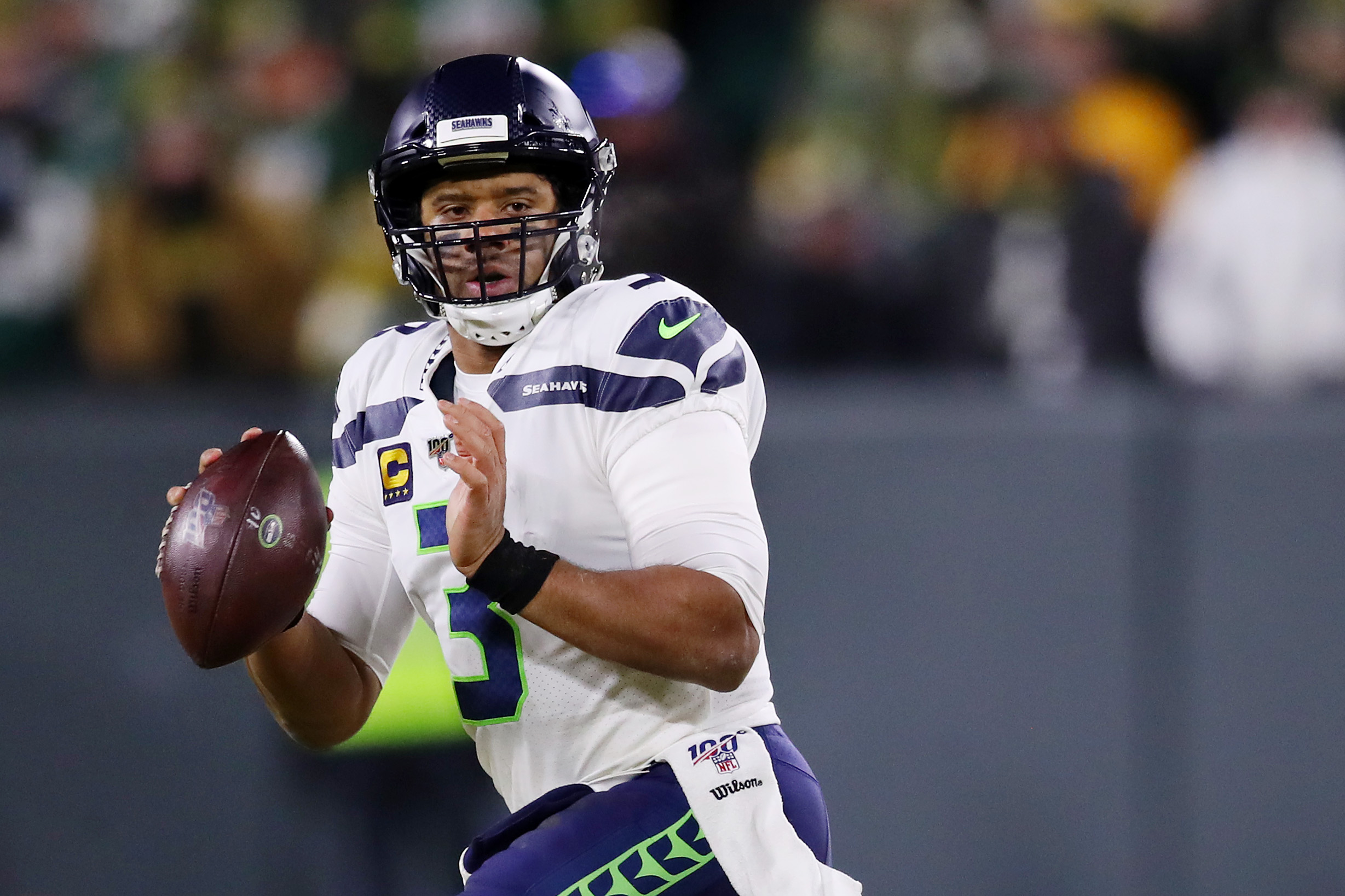 Russell Wilson of the Seattle Seahawks looks to pass during the first half against the Green Bay Packers in the NFC Divisional Playoff game at Lambeau Field on Jan. 12, 2020 in Green Bay, Wisconsin. (Gregory Shamus/Getty Images)