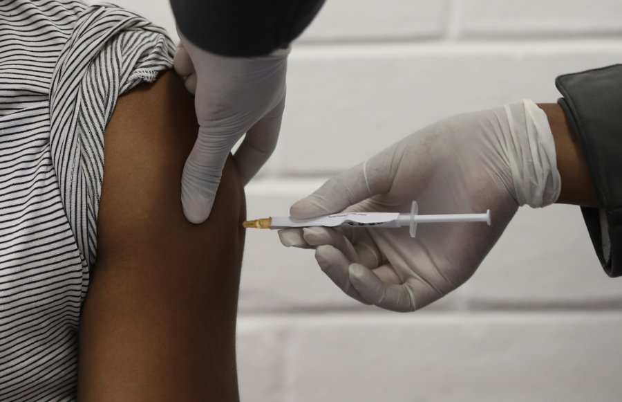 One of the first South African Oxford vaccine trialists is injected with the clinical trial for a potential coronavirus vaccine in Soweto, South Africa, on June 24 ,2020. (SIPHIWE SIBEKO/ POOL/AFP via Getty Images)