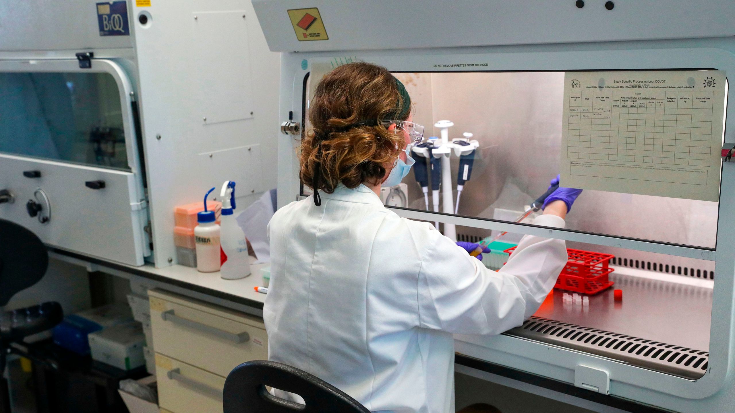 A scientist works to establish a viable vaccine against COVID-19 in laboratory at the Churchill Hospital in Oxford, west of London, on June 24, 2020. (Steve Parsons / AFP / Getty Images)