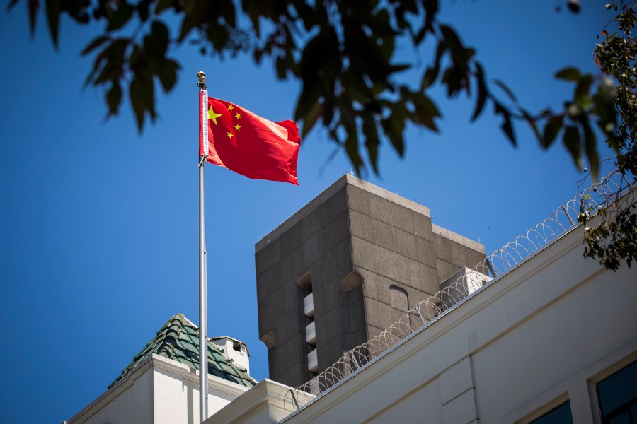 The flag of the People's Republic of China flies in the wind above the Consulate General of the People's Republic of China in San Francisco, on July 23, 2020. The U.S. Justice Department announced on July 23, 2020, the indictments of four Chinese researchers it said lied about their ties to the People's Liberation Army, with one escaping arrest by taking refuge in the country's San Francisco consulate. (Philip Pacheco / AFP via Getty Images)